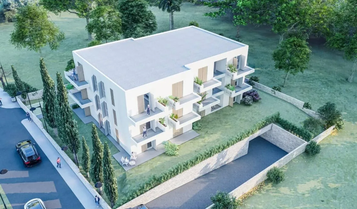 Aerial view of the modern two-story residential building in Orebić, Croatia, designed by Studio Hatch, showcasing balconies and an underground garage.