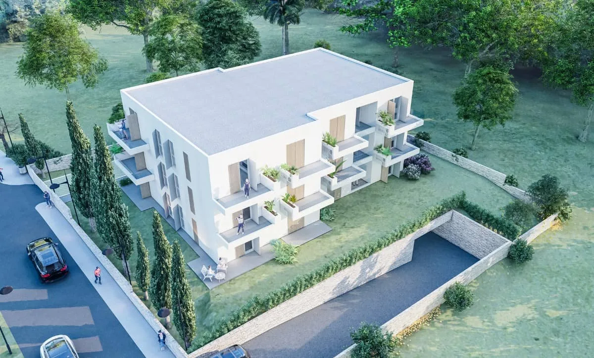 Aerial view of the modern two-story residential building in Orebić, Croatia, designed by Studio Hatch, showcasing balconies and an underground garage.