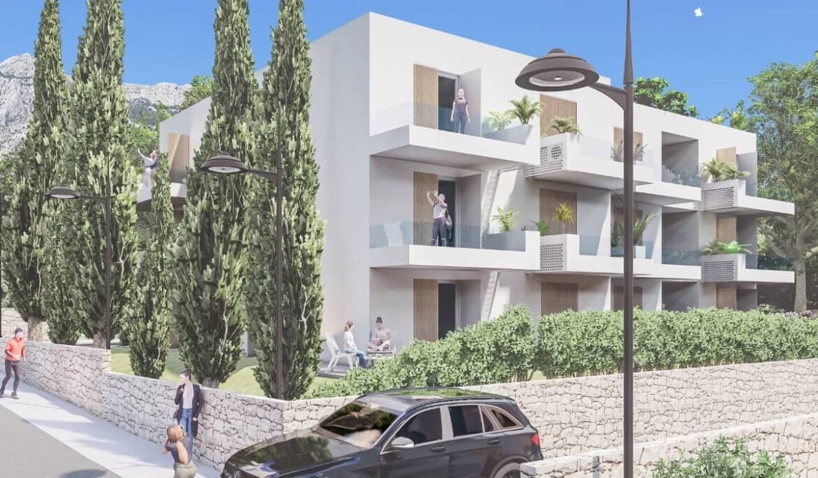 Street-level view of a two-story residential building with balconies, designed by Studio Hatch in Orebić, Croatia.