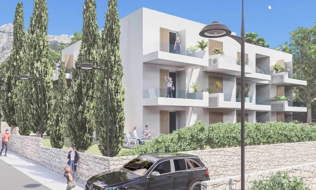 Street-level view of a two-story residential building with balconies, designed by Studio Hatch in Orebić, Croatia.