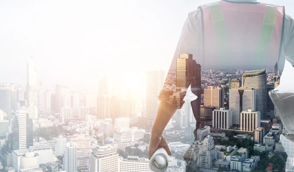 A project manager overlooking a modern city skyline, symbolizing coordination of construction, architectural planning, and project management services.