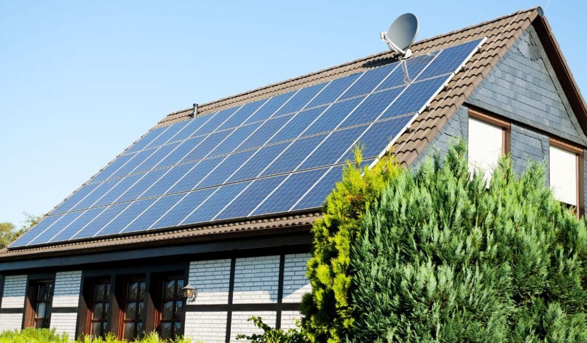 Solar panels on a roof representing energy-efficient solutions by Studio Hatch's energy modeling consulting services.